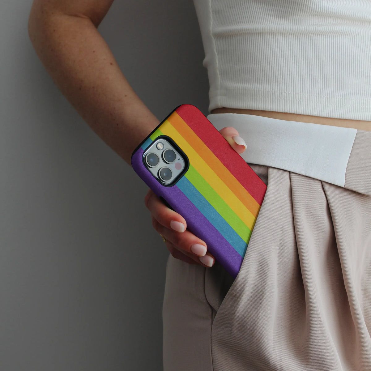 Rainbow iPhone case — bold spectrum artwork on a dual-layer MagSafe shell