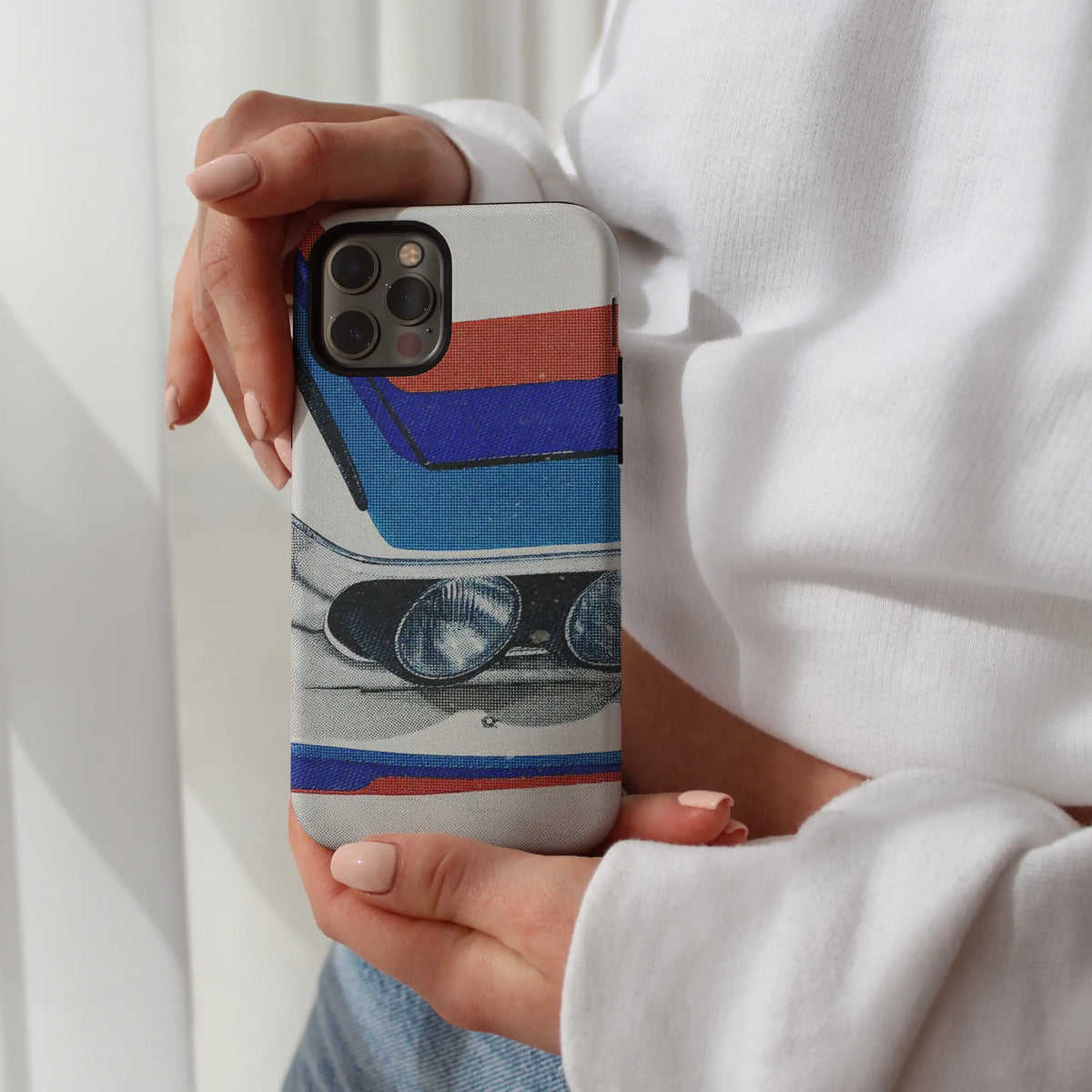 Art Livery iPhone case — dual round headlights and racing stripes on a MagSafe shell