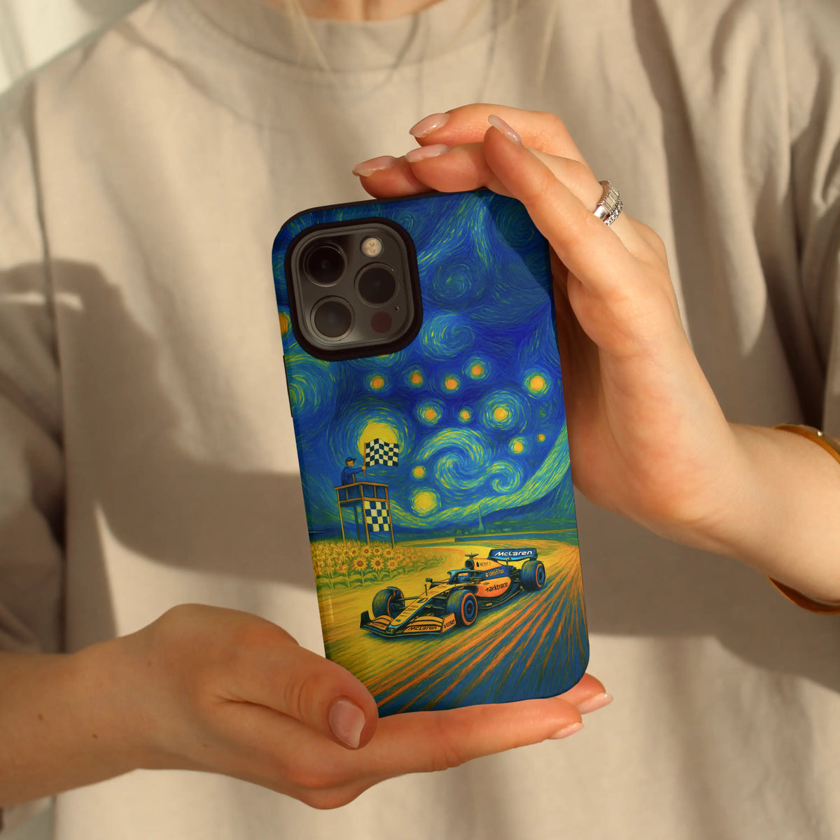 Starry Speed ML iPhone case — papaya orange and indigo swirls on a MagSafe shell