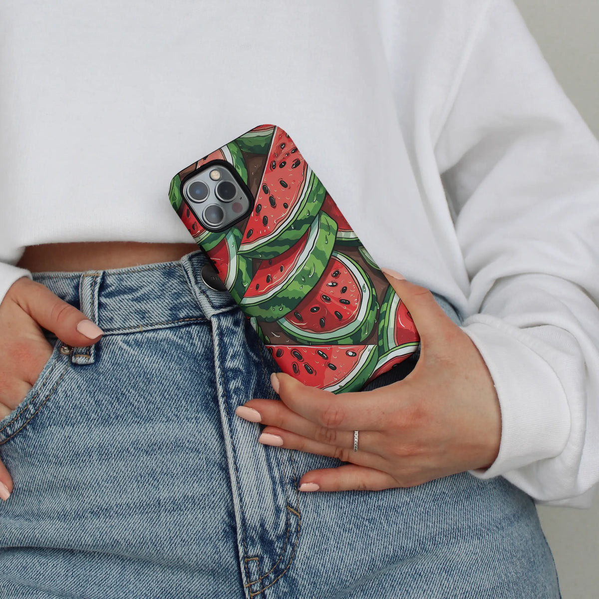Watermelon iPhone case — red flesh and black seeds on a MagSafe shell